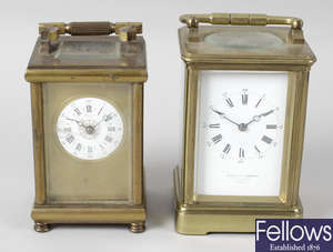 A late 19th century brass cased carriage clock, together with four other assorted carriage clocks.