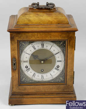 A mid 20th century Garrard and Co walnut cased bracket style mantel clock.