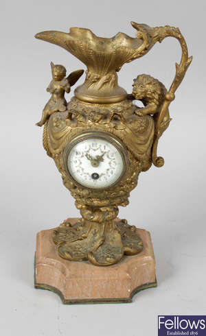A late 19th century gilt metal novelty desk clock modelled as a ewer.