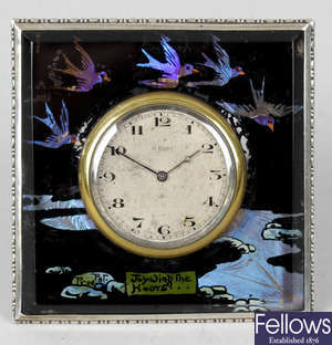 An early 20th century moth wing decorated, Birmingham hallmarked silver framed easel style clock.