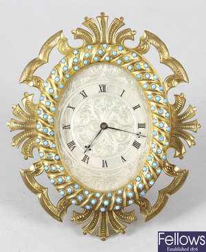 A Victorian gilt metal and turquoise set easel style clock.