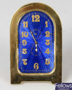 A Longines gilt metal and enamel easel style clock.