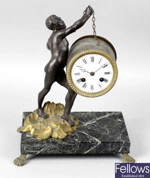 A cast metal mantel clock.