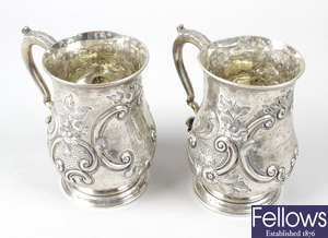 Two mid-Victorian silver embossed mugs.