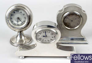 Five silver cased dressing table clocks.
