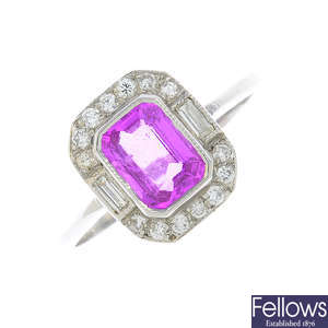 A pink sapphire and diamond dress ring.