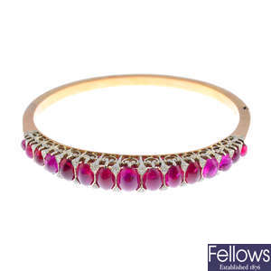 A mid 20th century silver and 18ct gold, ruby and diamond hinged bangle.