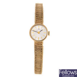 JAQUET-DROZ - a lady's 9ct yellow gold bracelet watch.
