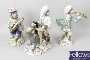 A mixed selection of assorted items to include a pair of Sitzendorf figurines, Beswick plaque, two Beswick collectors international Christmas plates, a five piece monkey band, replica scent bottles, etc.
