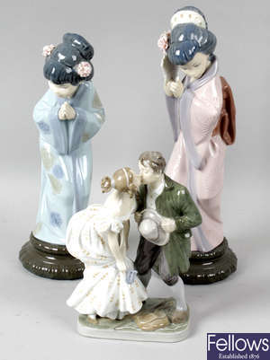 A Royal Copenhagen porcelain figure group, a pair of Lladro pottery figures, a pair of Unter Weiss Bach porcelain figures, and another similar figure.