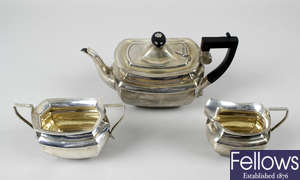 An Edwardian silver three piece bachelor tea service.