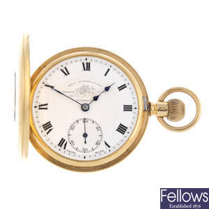 An 18ct yellow gold half hunter pocket watch by T.Russell & Son.