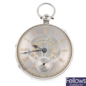 A silver open face pocket watch with two silver pocket watches.