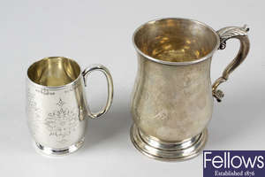 A Victorian silver christening mug & a larger Edwardian silver mug. (2).