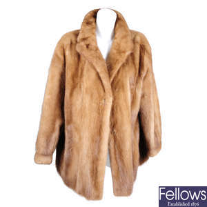 A three-quarter length pastel mink fur coat.
