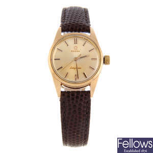 OMEGA - a lady's gold plated Ladymatic wrist watch with an Omega movement.
