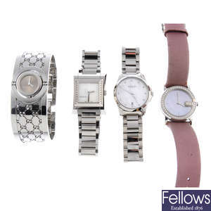 A group of four assorted lady's Gucci watches.