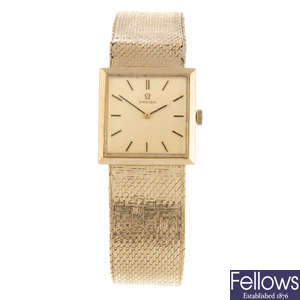 OMEGA - a gentleman's 9ct yellow gold bracelet watch.