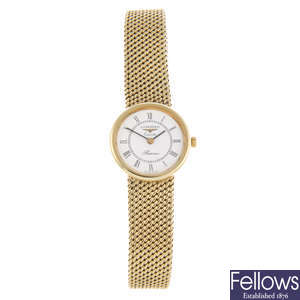 LONGINES - a lady's 9ct yellow gold bracelet watch.