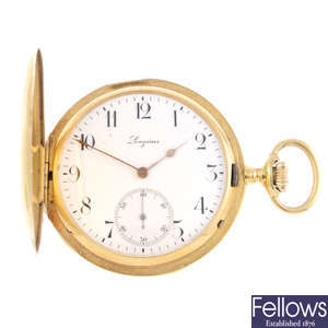 A yellow metal full hunter pocket watch by Longines.