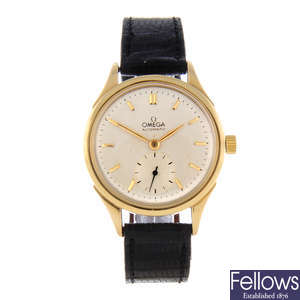 OMEGA - a mid-size 18ct yellow gold wrist watch.