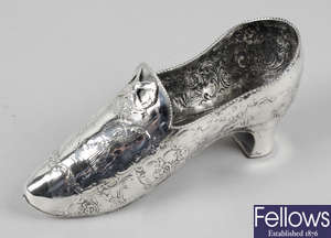 A late nineteenth century silver import model of a lady's heeled shoe.