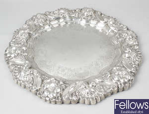 Two Portuguese silver salvers, plus an unmarked oval platter. (3).