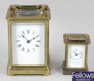 A brass cased carriage clock, together with a small Matthew Norman brass case carriage clock.