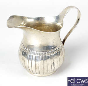 A George III Irish silver cream jug.