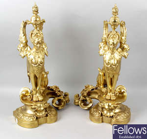 A pair of 19th century gilt metal fire dogs.