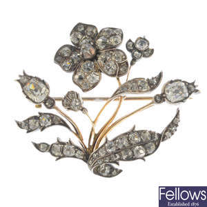 An early 19th century silver and gold diamond floral brooch.