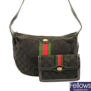 GUCCI - a vintage black canvas bag with matching purse.