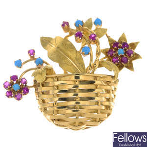 An 18ct gold synthetic ruby and blue glass floral basket brooch.