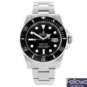 CURRENT MODEL: ROLEX - a gentleman's stainless steel Oyster Perpetual Date Submariner bracelet watch.
