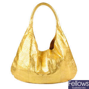 DELVI KROELL - a large gold python skin hobo handbag.