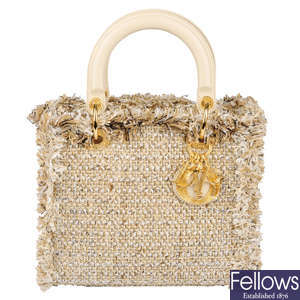 CHRISTIAN DIOR - a beige tweed Lady Dior MM handbag.