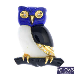 A diamond and gem-set owl brooch.