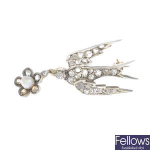 An early 20th century diamond and pearl swallow brooch.