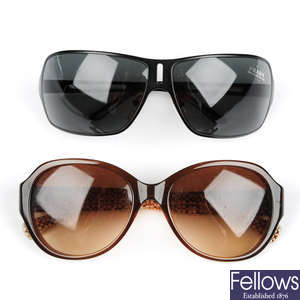 Two pairs of designer sunglasses.