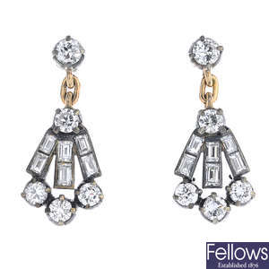 A pair of diamond drop earrings.
