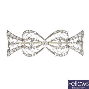 An Edwardian diamond bow brooch.