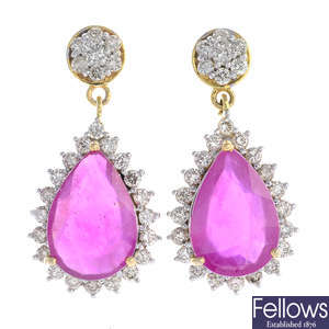 A pair of glass-filled ruby and diamond cluster earrings.