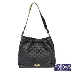 LOVE MOSCHINO - a quilted black handbag.