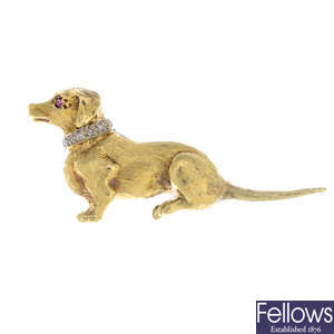 A 1960s 18ct gold ruby and diamond Dachshund dog brooch.