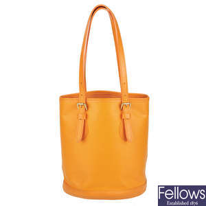 LOUIS VUITTON - a mandarin orange Epi Bucket handbag.