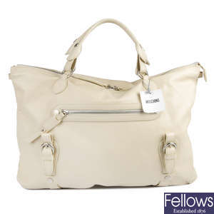 MOSCHINO - a large cream leather handbag.