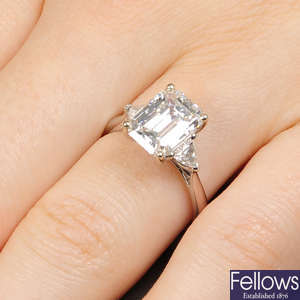 An 18ct gold rectangular-shape diamond single-stone ring, of 3.26cts, with triangular-shape diamond sides.