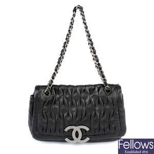 LOT:57  CHANEL - a horizontal quilted double flap handbag.