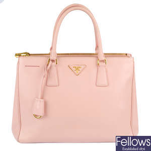 PRADA - a pink Saffiano leather handbag.