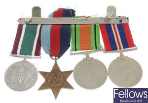A selection of WWII medals including a mounted Trio, etc.